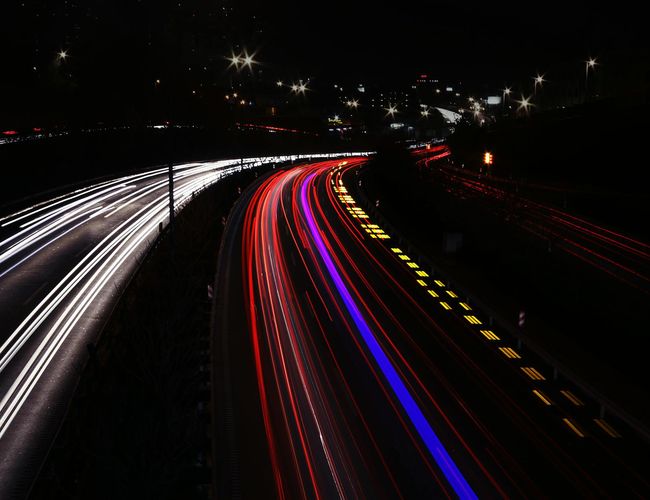 Dynamic light trails representing energy movement in space